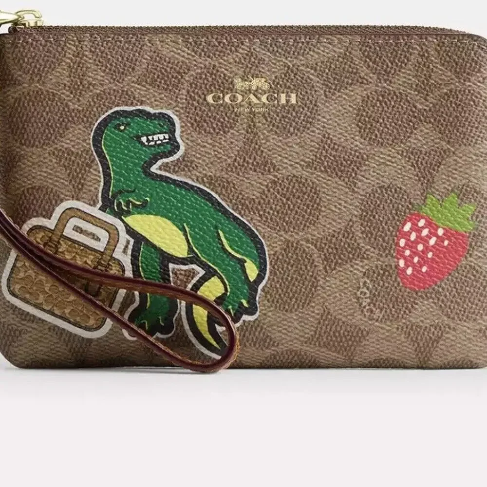 NWT Coach Corner Zip Wristlet In Signature Canvas With Sticker Print Rexy TRex